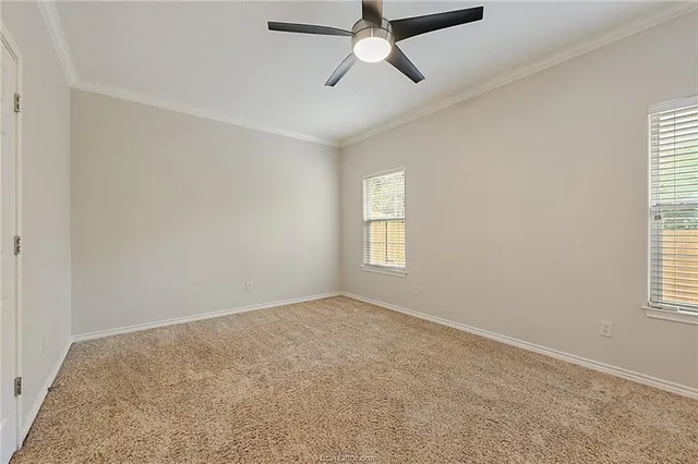 a view of empty room with windows