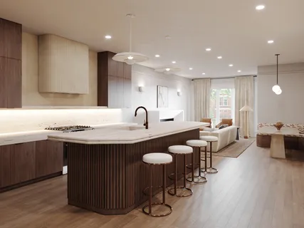 a large kitchen with lots of counter space a sink and a refrigerator