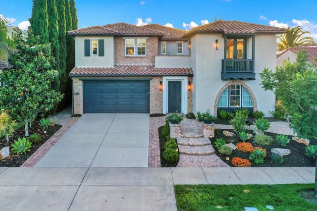 a view of a patio with table and chairs and potted plants