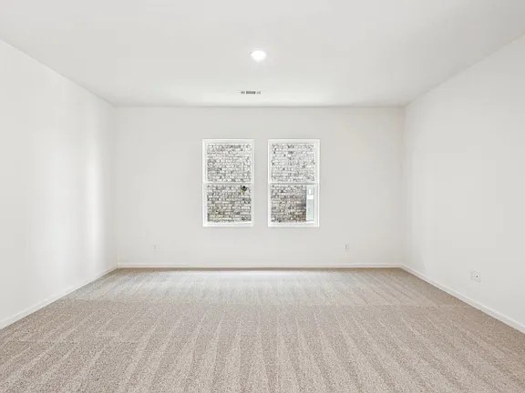 152 Mullen Way Taylor, TX 76574 - Photo 10 of 21 an empty room with windows