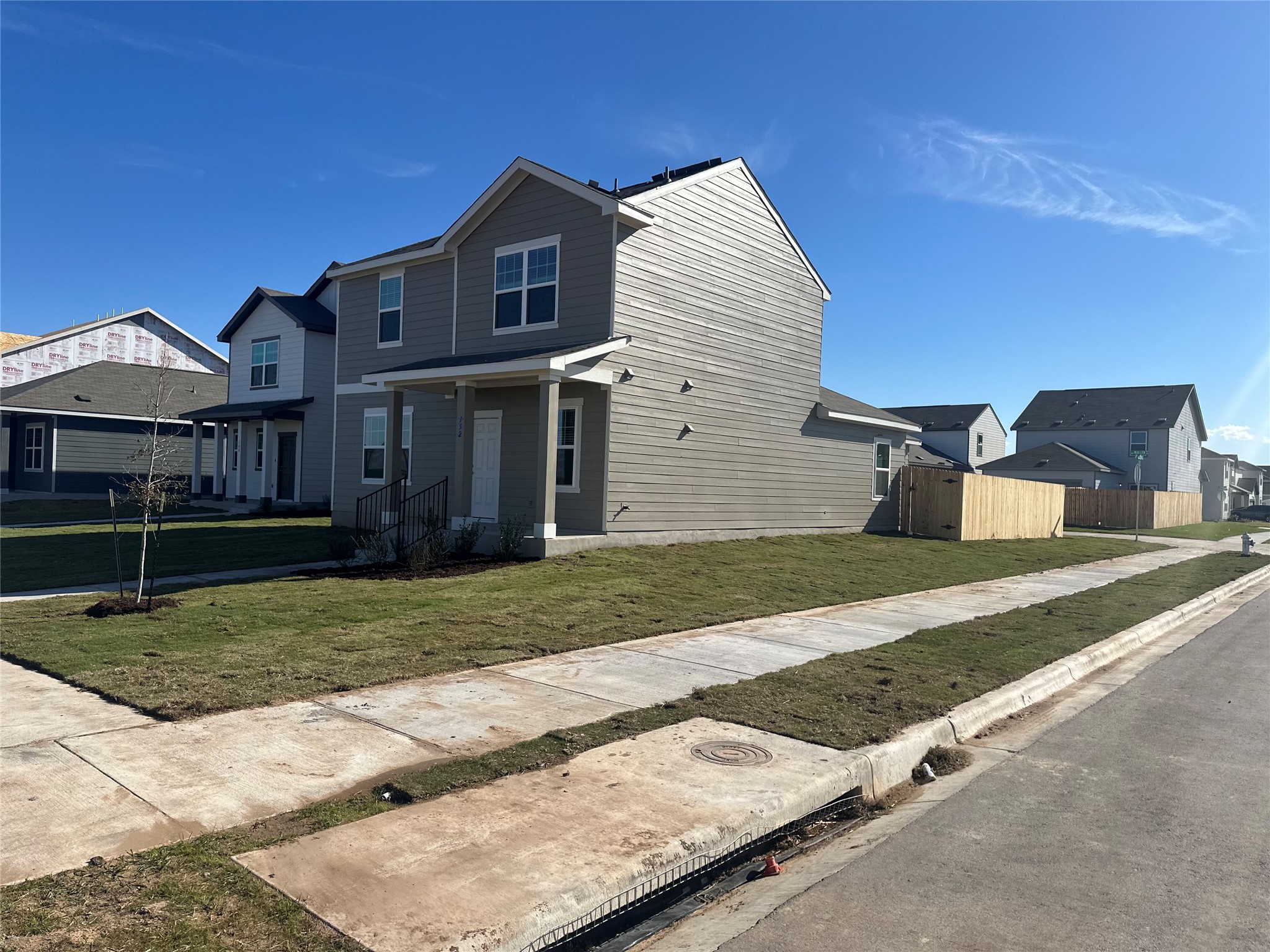 152 Mullen Way Taylor, TX 76574 - Photo 2 of 21 a front view of a house with a yard
