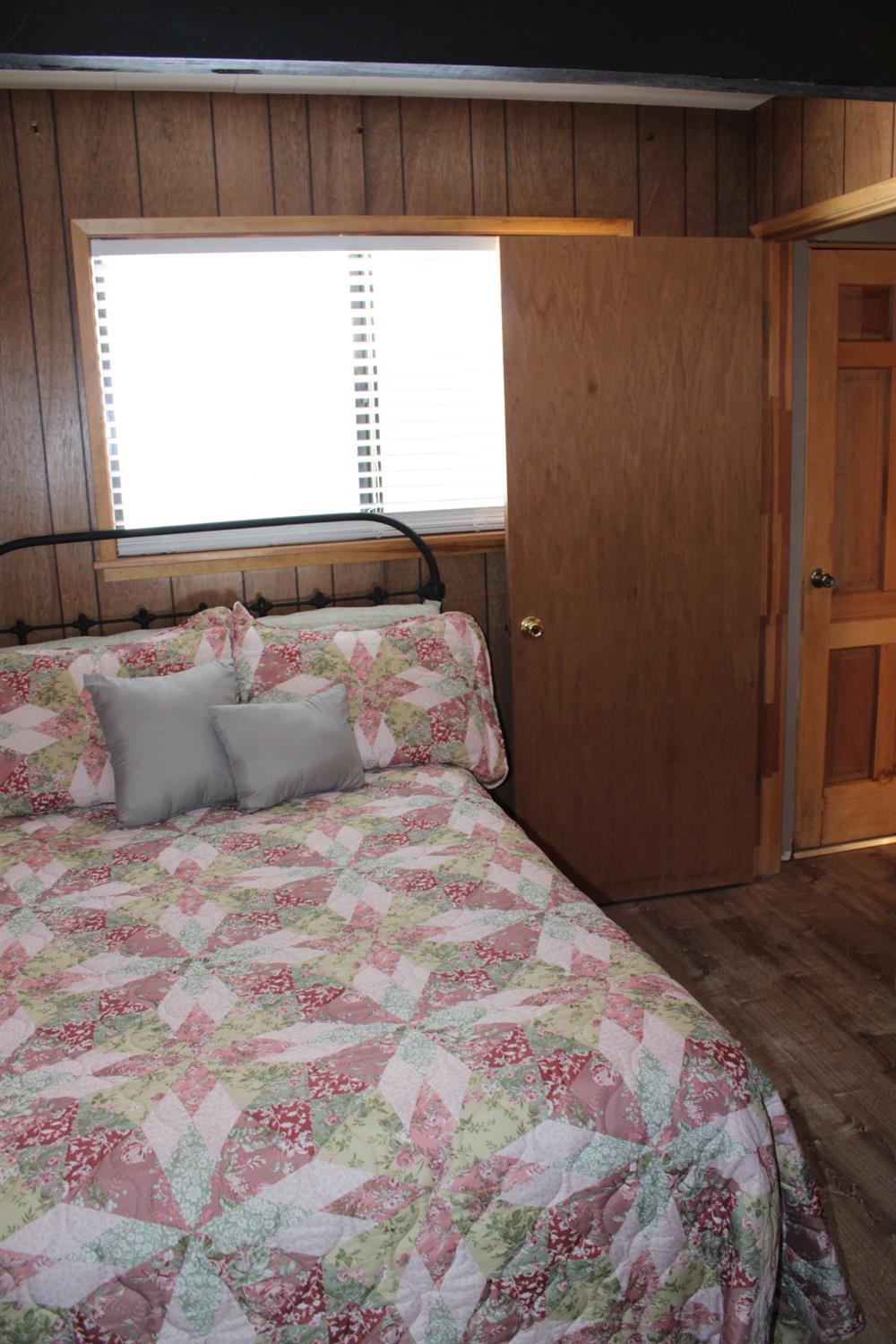 1140 Mountain View Road Arnold, CA 95223 - Photo 17 of 24 a bedroom with a bed and a window