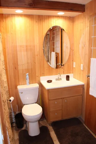 a bathroom with a toilet sink and shower