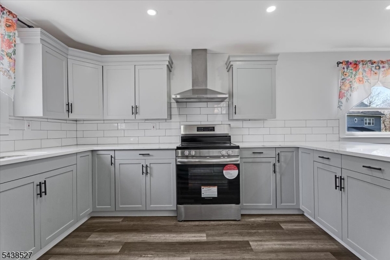 83 Highway 15 Lafayette, NJ 07848 - Photo 5 of 20 a kitchen with stainless steel appliances granite countertop a stove and white cabinets