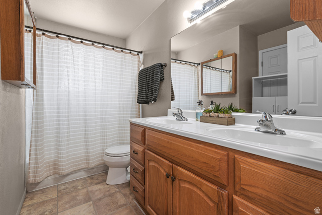 3951 Brixton Road Salt Lake City, UT 84129 - Photo 12 of 22 Double vanity with integrated sinks and chrome fixtures
