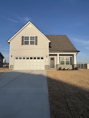 a front view of a house with yard