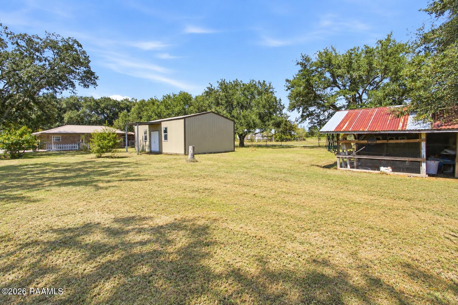 2685 Lloyd Road Maurice, LA 70555 - Photo 6 of 19 Mowed Rural Yard with Workshop and Coop