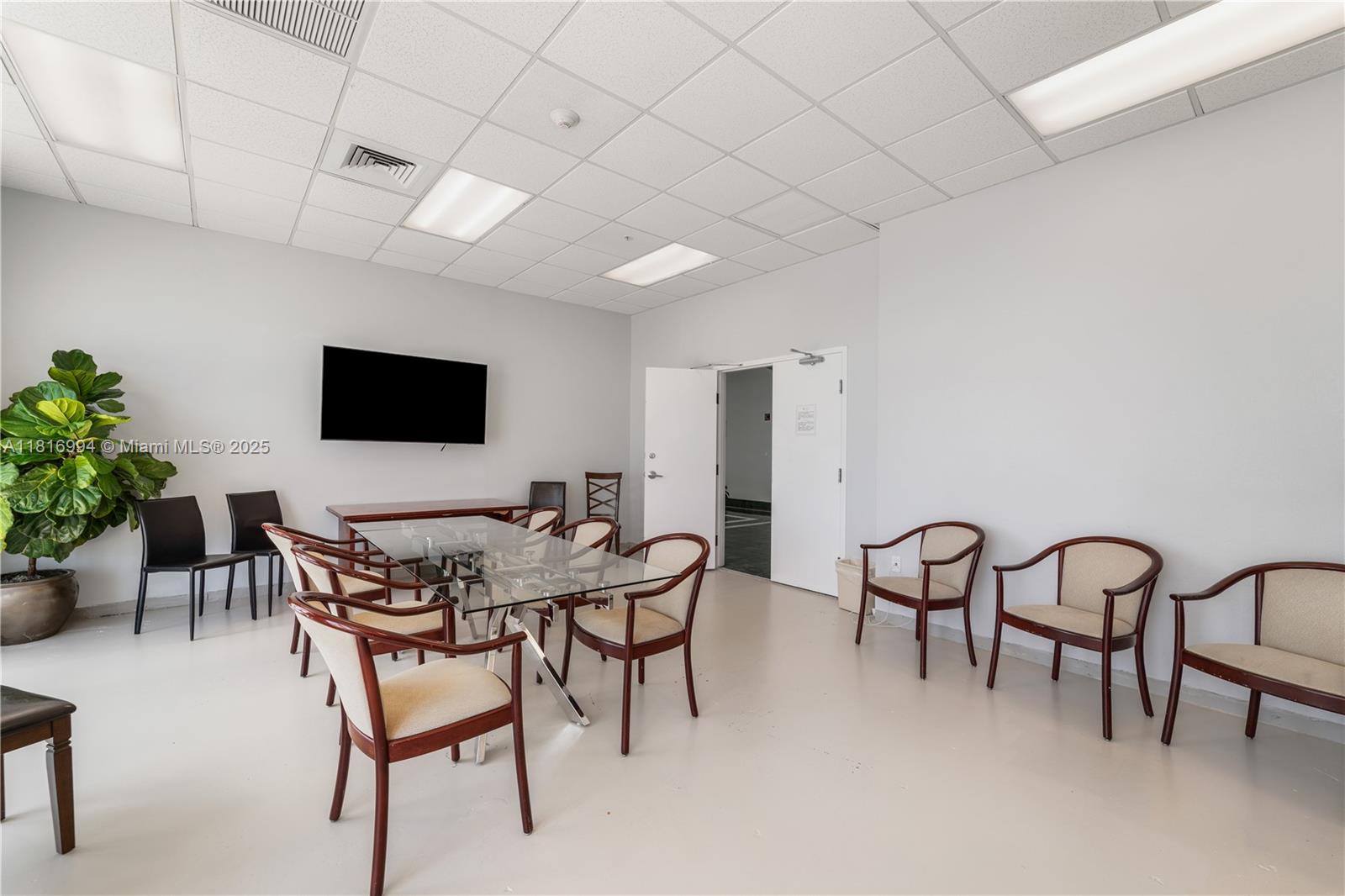 800 Claughton Island Drive, Unit 1103 Miami, FL 33131 - Photo 15 of 40 a view of a livingroom with furniture and a flat screen tv