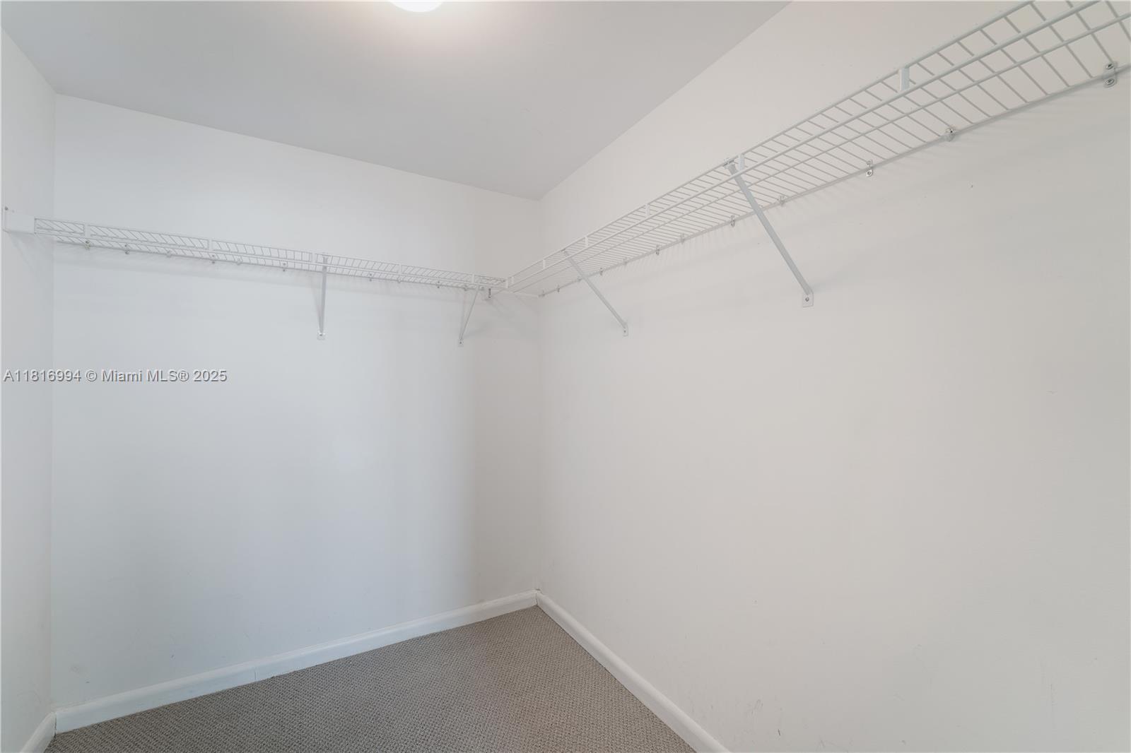 800 Claughton Island Drive, Unit 1103 Miami, FL 33131 - Photo 18 of 40 a view of a room with racks on the wall