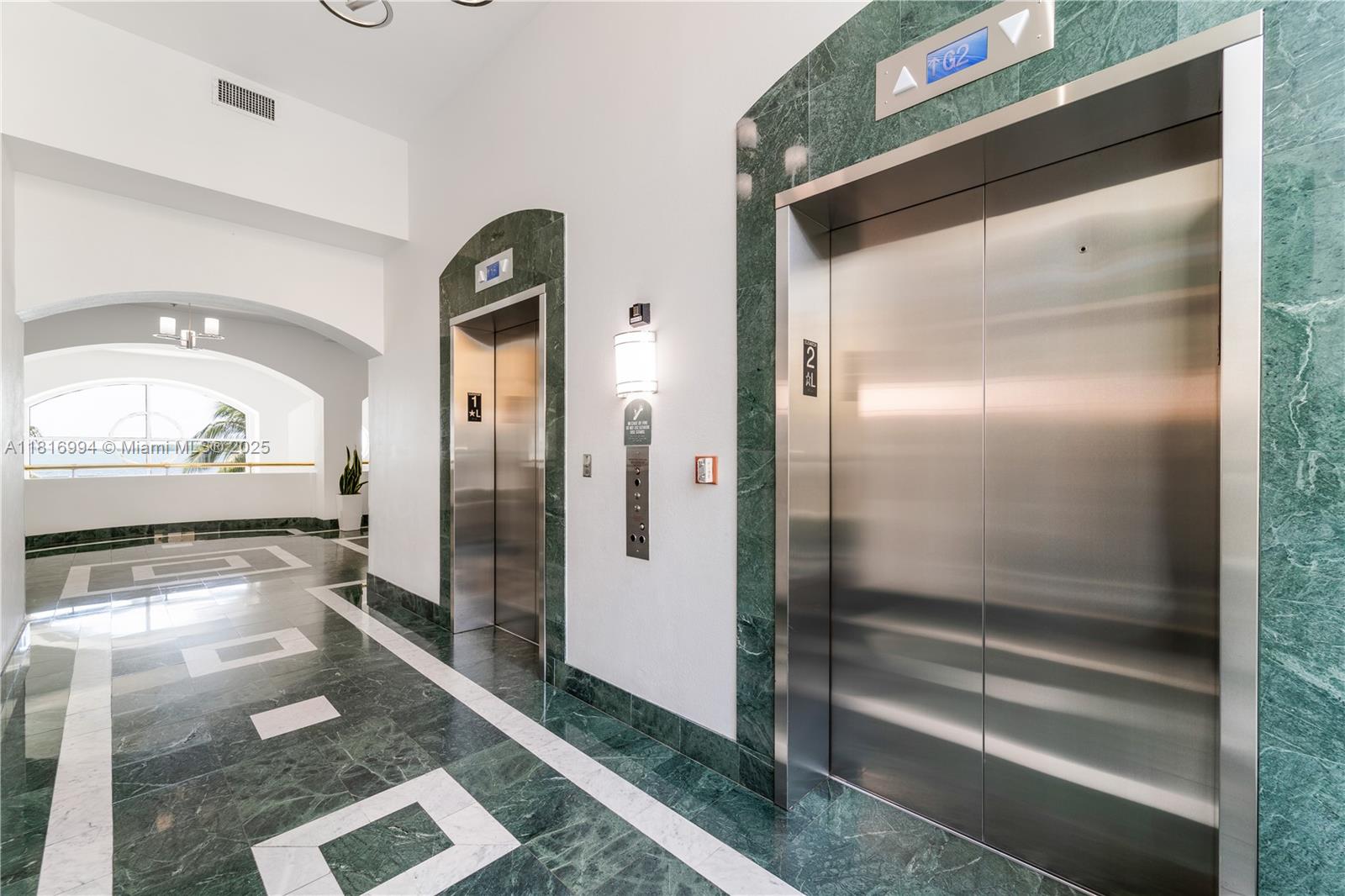 800 Claughton Island Drive, Unit 1103 Miami, FL 33131 - Photo 25 of 40 a bathroom with a glass shower door and a mirror