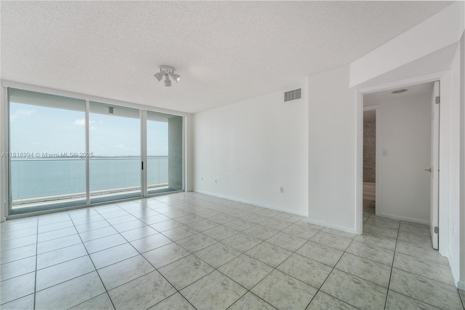 800 Claughton Island Drive, Unit 1103 Miami, FL 33131 - Photo 27 of 40 a view of an empty room and window