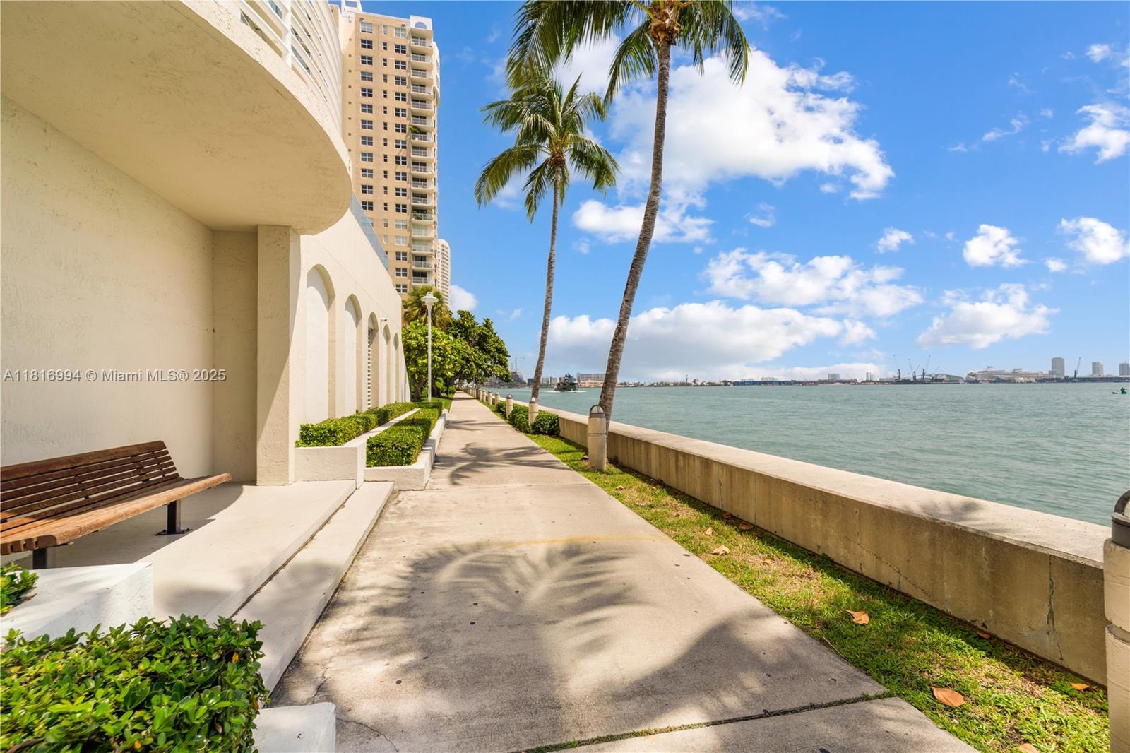 800 Claughton Island Drive, Unit 1103 Miami, FL 33131 - Photo 33 of 40 a view of swimming pool with a table and chairs