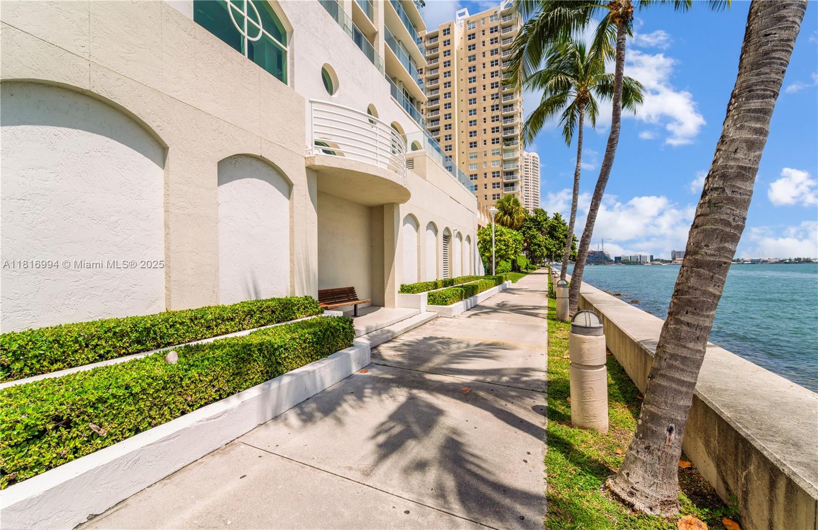 800 Claughton Island Drive, Unit 1103 Miami, FL 33131 - Photo 34 of 40 a front view of a house with a garden
