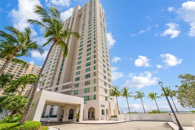 a kitchen with granite countertop a refrigerator stove and microwave