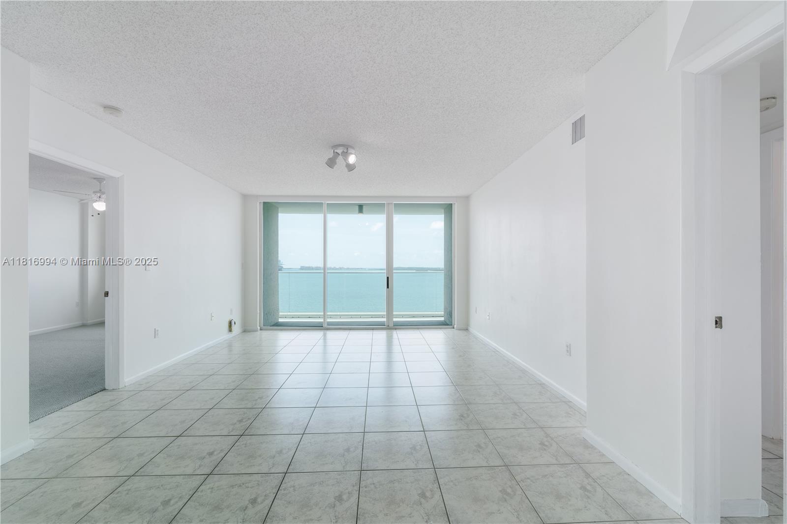 800 Claughton Island Drive, Unit 1103 Miami, FL 33131 - Photo 4 of 40 a view of an empty room with a window