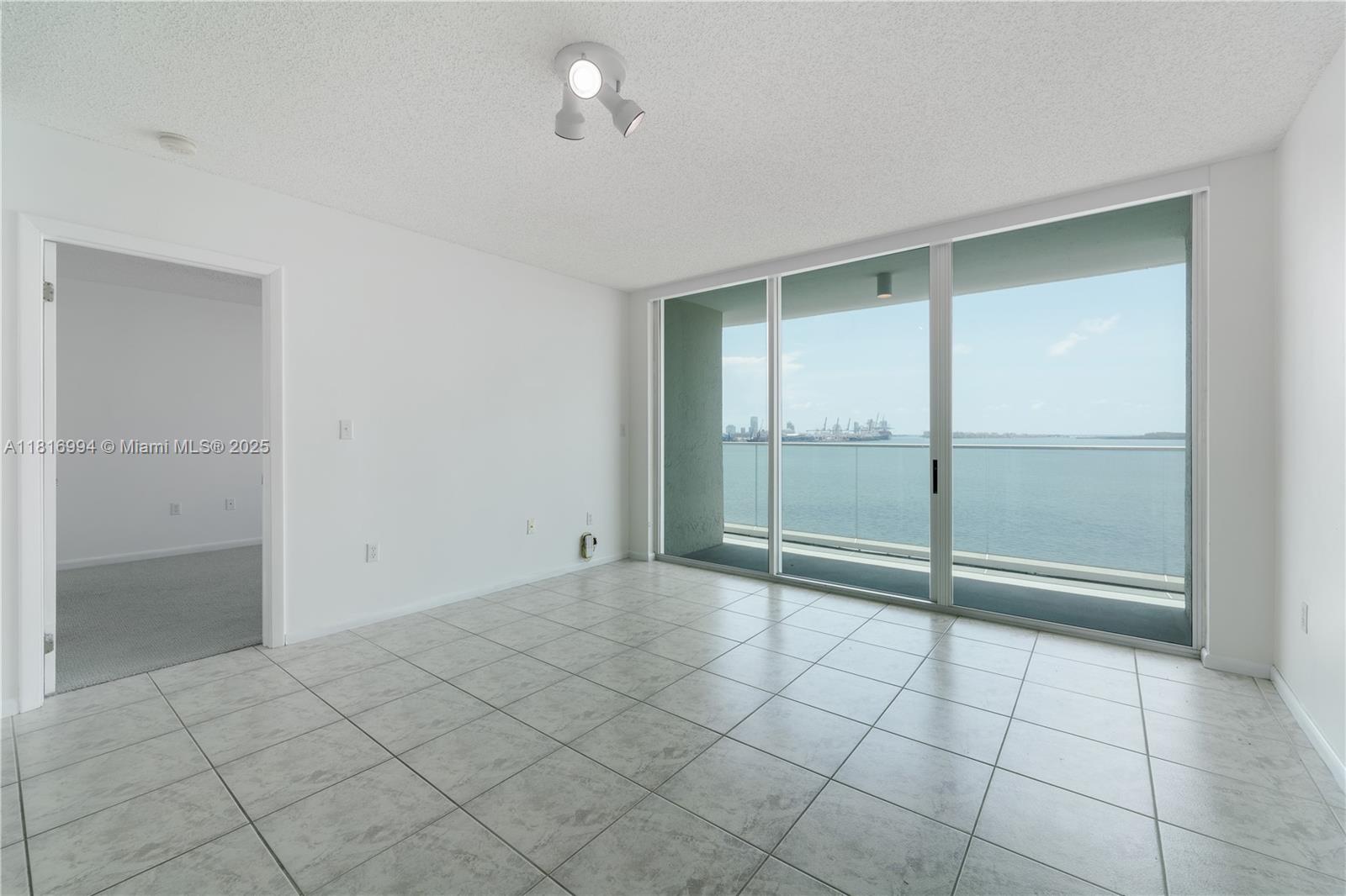 800 Claughton Island Drive, Unit 1103 Miami, FL 33131 - Photo 9 of 40 a view of an empty room with a window