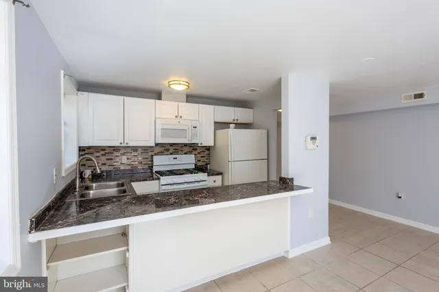 a bathroom with a sink and a bathtub
