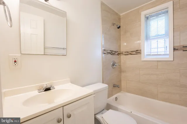 a backyard of a house with shaded area