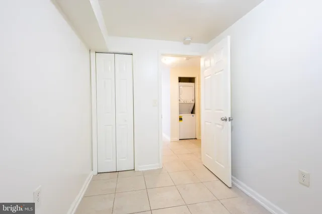 a kitchen with granite countertop white cabinets and appliances