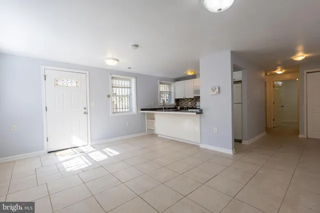 a kitchen with a stove and a refrigerator