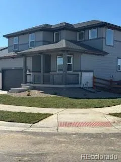 a view of a brick house with a swimming pool