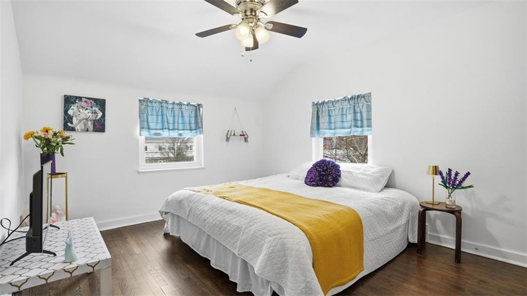 502 Weyman Road Pittsburgh, PA 15236 - Photo 16 of 39 a bedroom with a bed and wooden floor