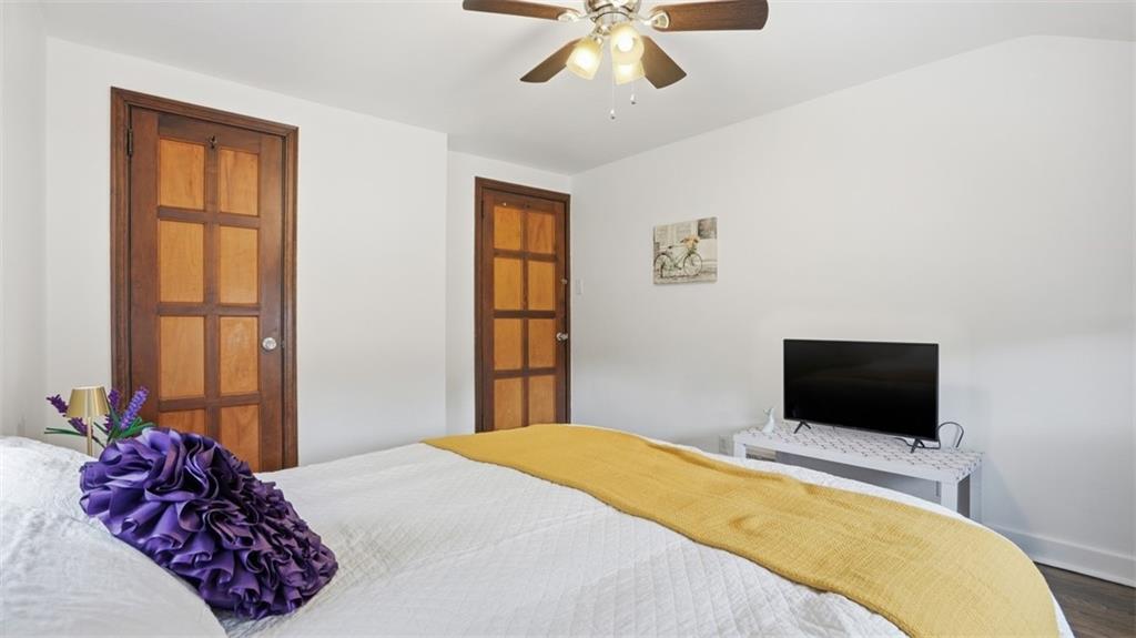 502 Weyman Road Pittsburgh, PA 15236 - Photo 18 of 39 a bedroom with a bed and a flat screen tv