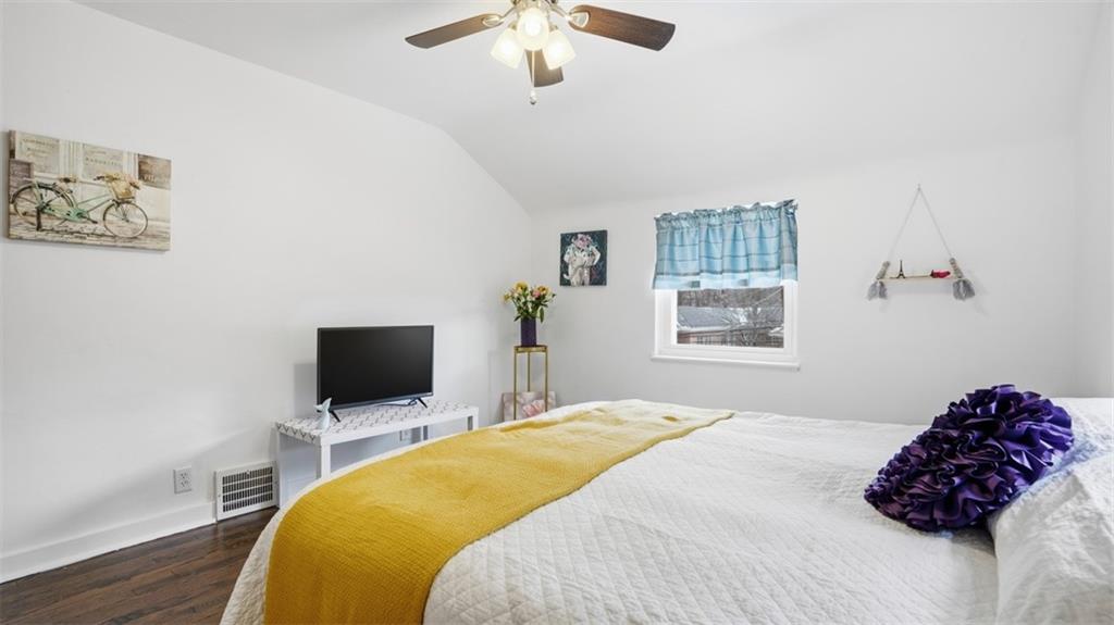 502 Weyman Road Pittsburgh, PA 15236 - Photo 19 of 39 a bedroom with a bed and a flat screen tv