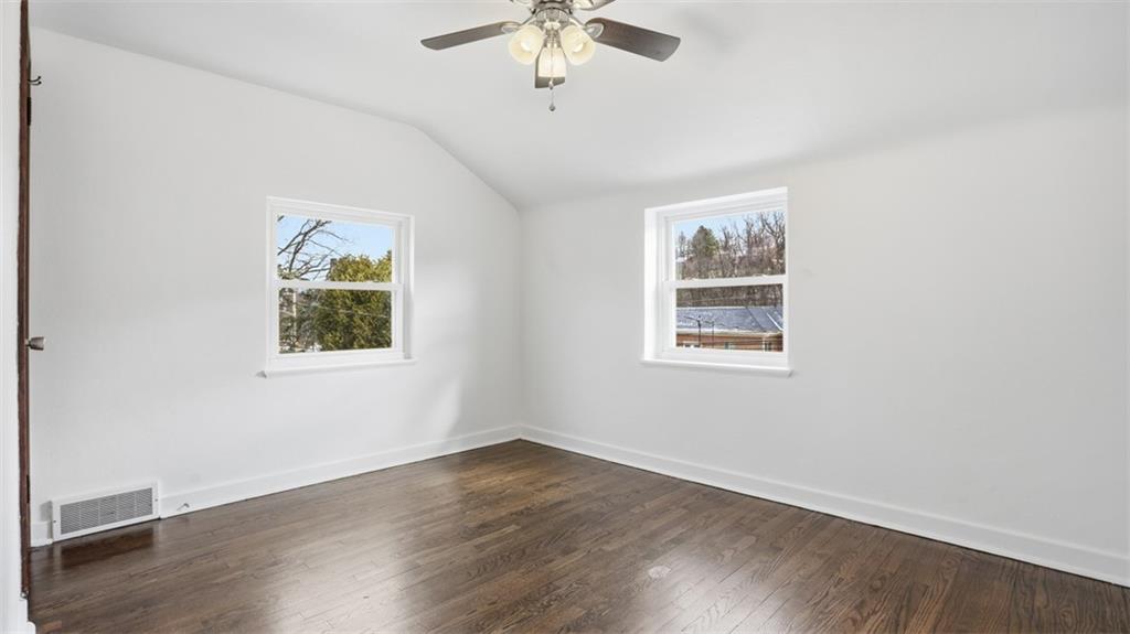 502 Weyman Road Pittsburgh, PA 15236 - Photo 23 of 39 wooden floor in an empty room with a window
