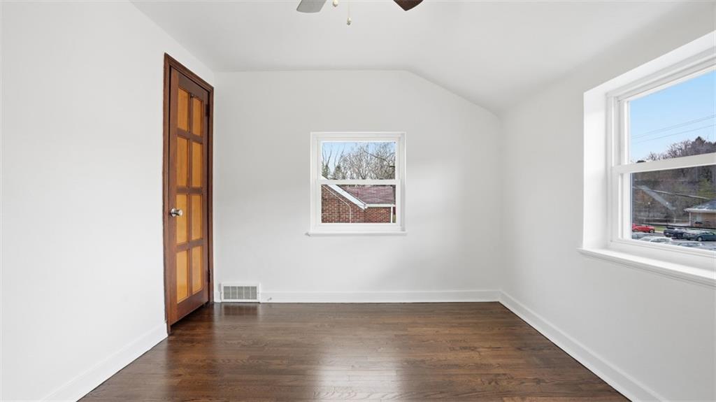 502 Weyman Road Pittsburgh, PA 15236 - Photo 24 of 39 an empty room with wooden floor and windows