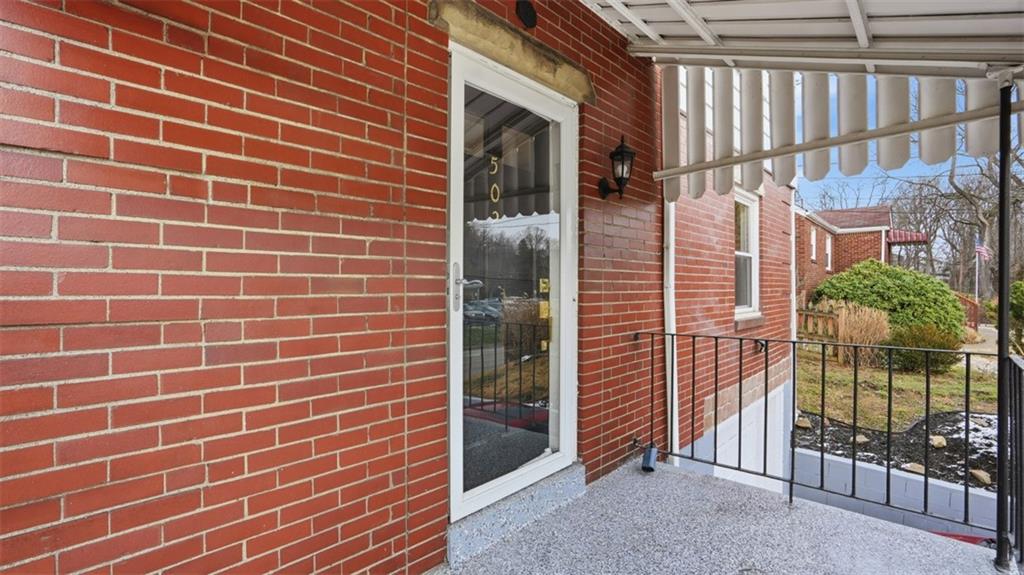 502 Weyman Road Pittsburgh, PA 15236 - Photo 3 of 39 a view of a brick wall of the house