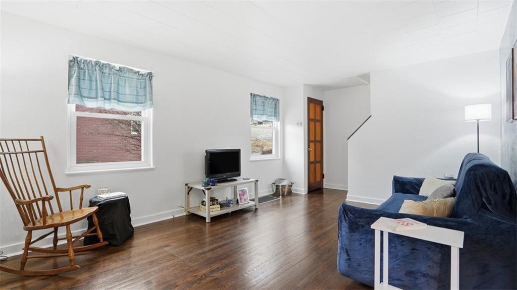 502 Weyman Road Pittsburgh, PA 15236 - Photo 6 of 39 a living room with furniture and a flat screen tv