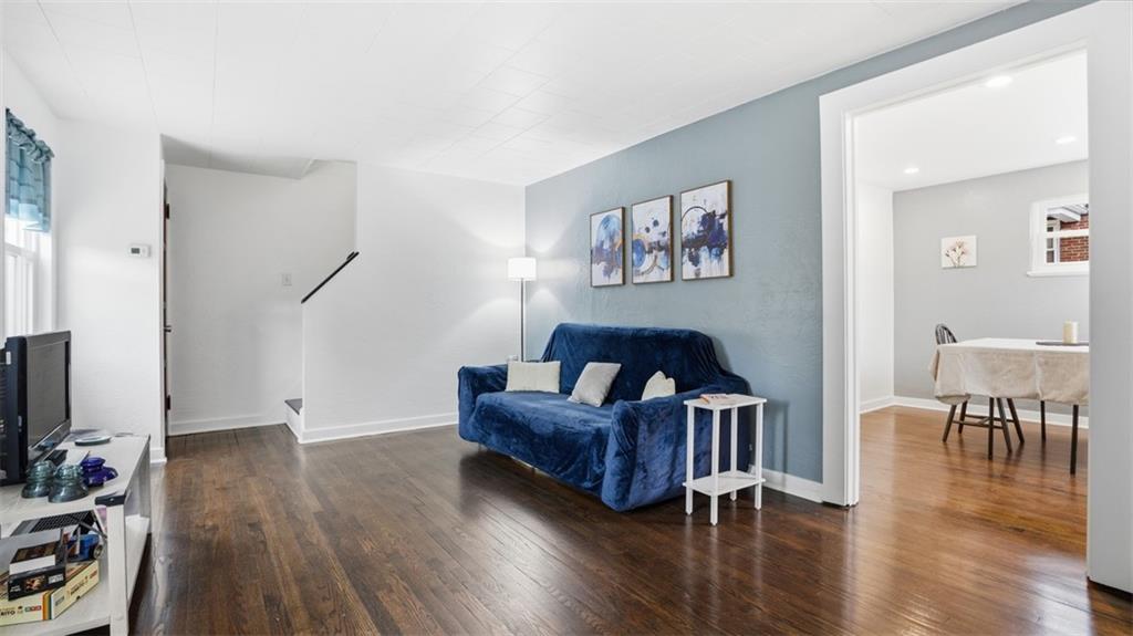 502 Weyman Road Pittsburgh, PA 15236 - Photo 7 of 39 a living room with furniture and a flat screen tv
