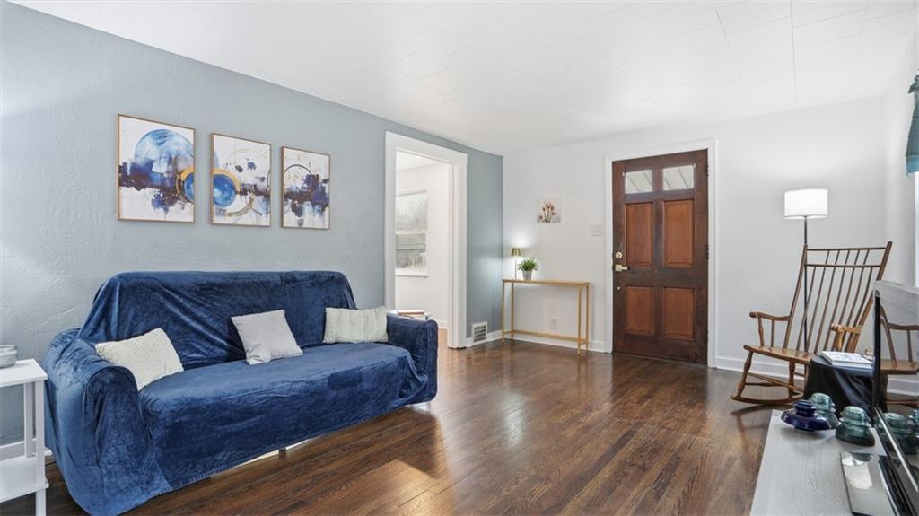 502 Weyman Road Pittsburgh, PA 15236 - Photo 8 of 39 a living room with furniture and a wooden floor