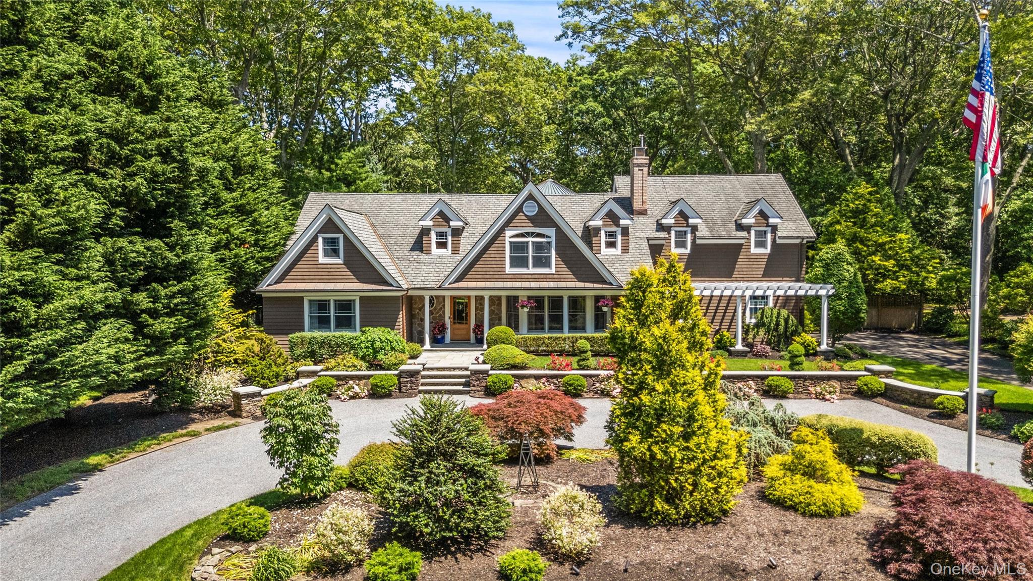 4745 North Bayview Road Southold, NY 11971 - Photo 1 of 31 Shingle-style home with a porch and a chimney