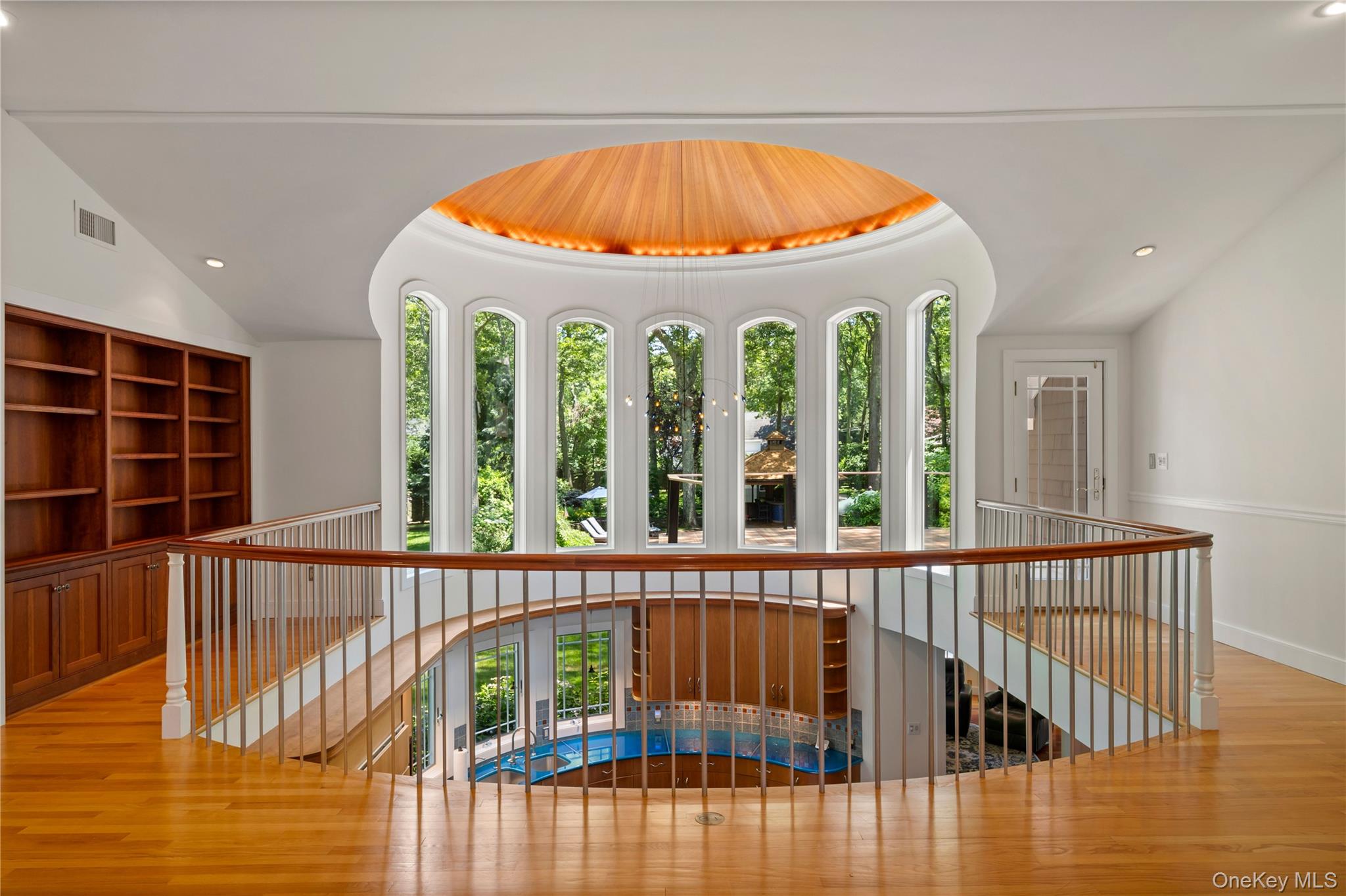 4745 North Bayview Road Southold, NY 11971 - Photo 11 of 31 Hall featuring an upstairs landing, wood finished floors, recessed lighting, and vaulted ceiling