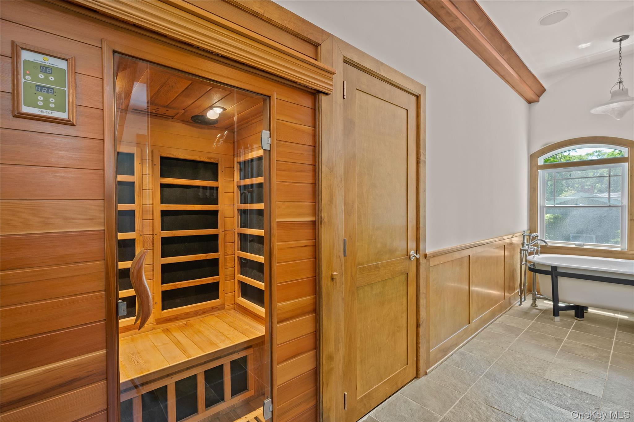 4745 North Bayview Road Southold, NY 11971 - Photo 16 of 31 Relaxing sauna with wainscoting and wooden walls