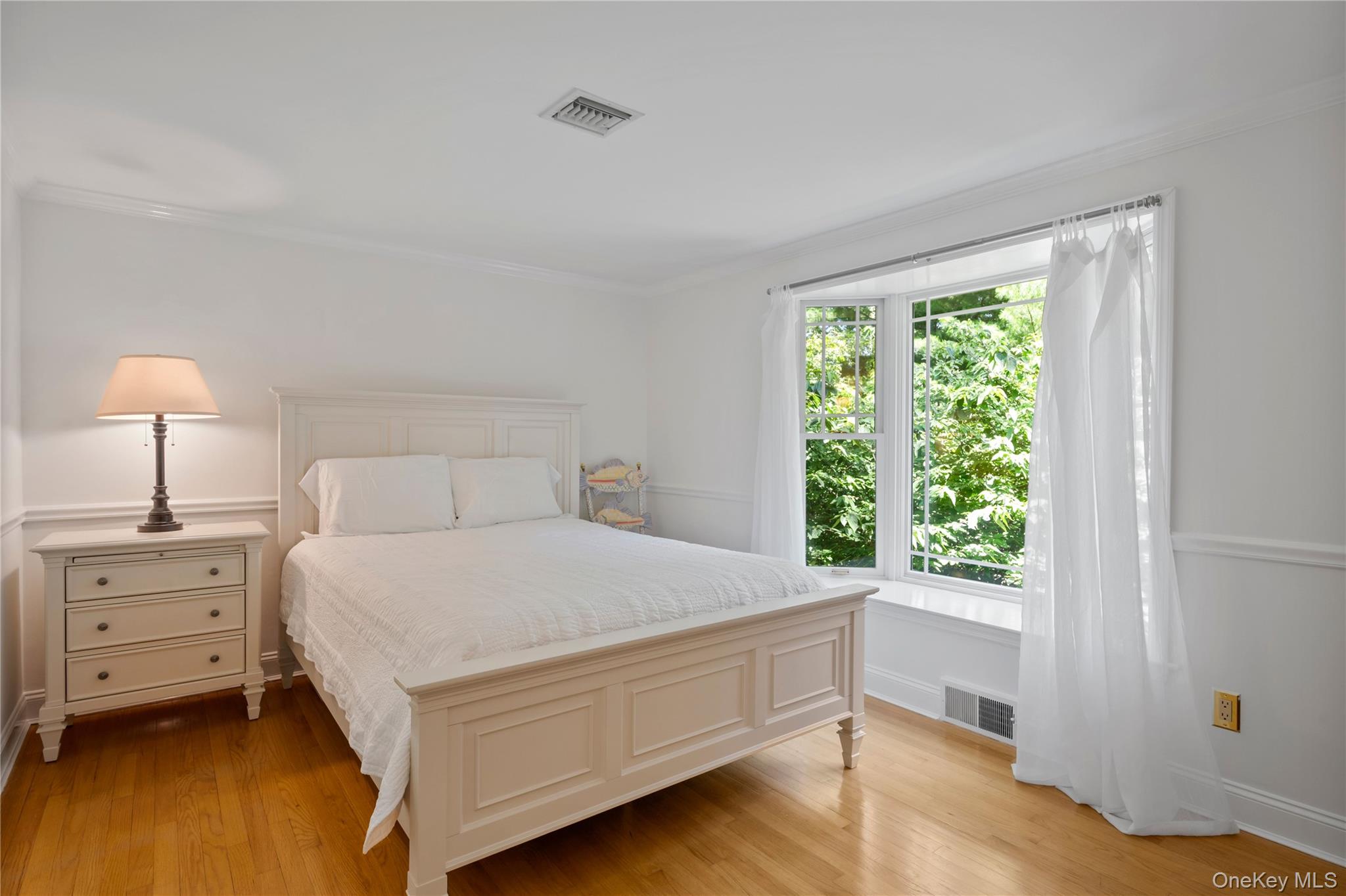 4745 North Bayview Road Southold, NY 11971 - Photo 19 of 31 Bedroom featuring ornamental molding and light wood finished floors