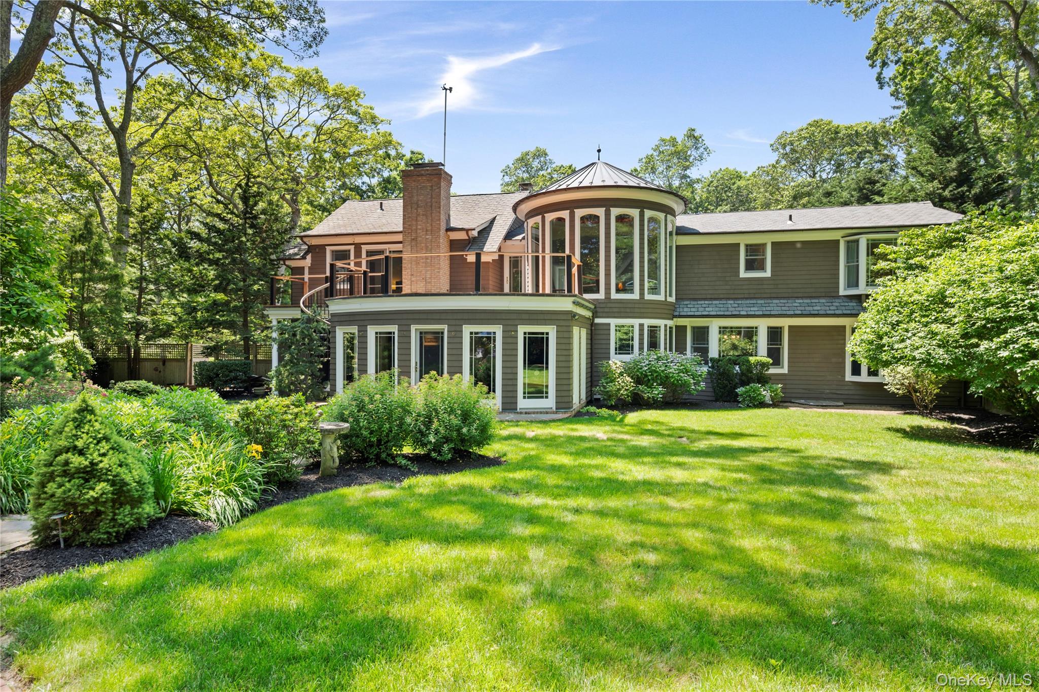 4745 North Bayview Road Southold, NY 11971 - Photo 22 of 31 Back of house featuring a chimney, a yard, and a balcony