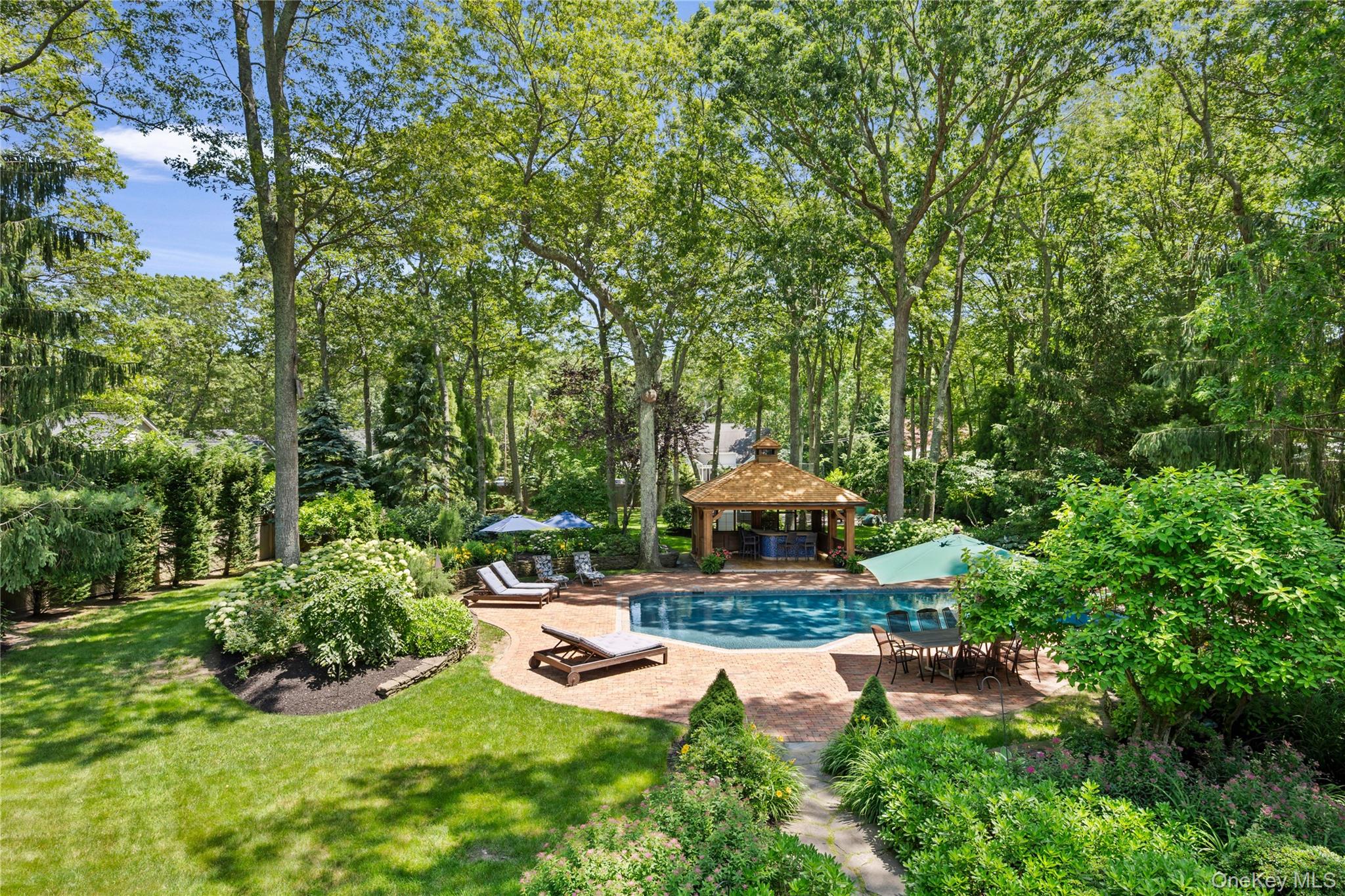 4745 North Bayview Road Southold, NY 11971 - Photo 24 of 31 Swimming pool featuring a gazebo, a patio, and a lawn