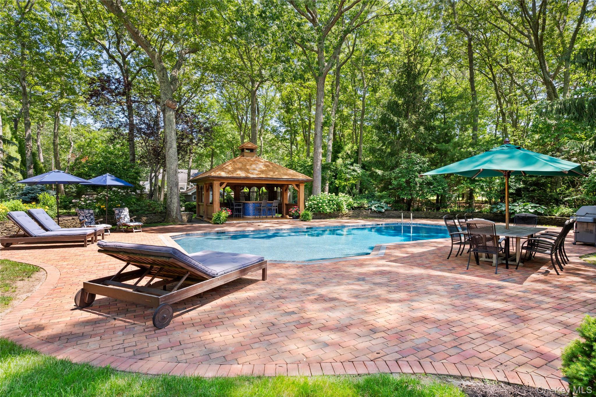 4745 North Bayview Road Southold, NY 11971 - Photo 26 of 31 Outdoor pool featuring a patio, a gazebo, a grill, and view of wooded area