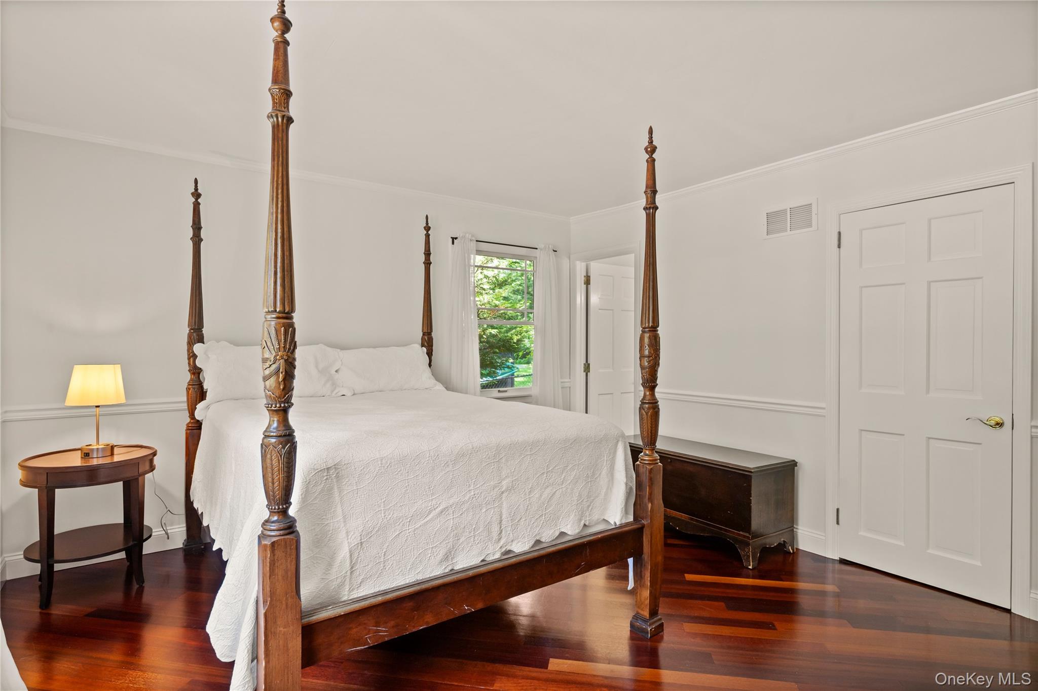 4745 North Bayview Road Southold, NY 11971 - Photo 9 of 31 Bedroom with ornamental molding and wood finished floors