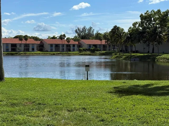 a view of a lake with a yard