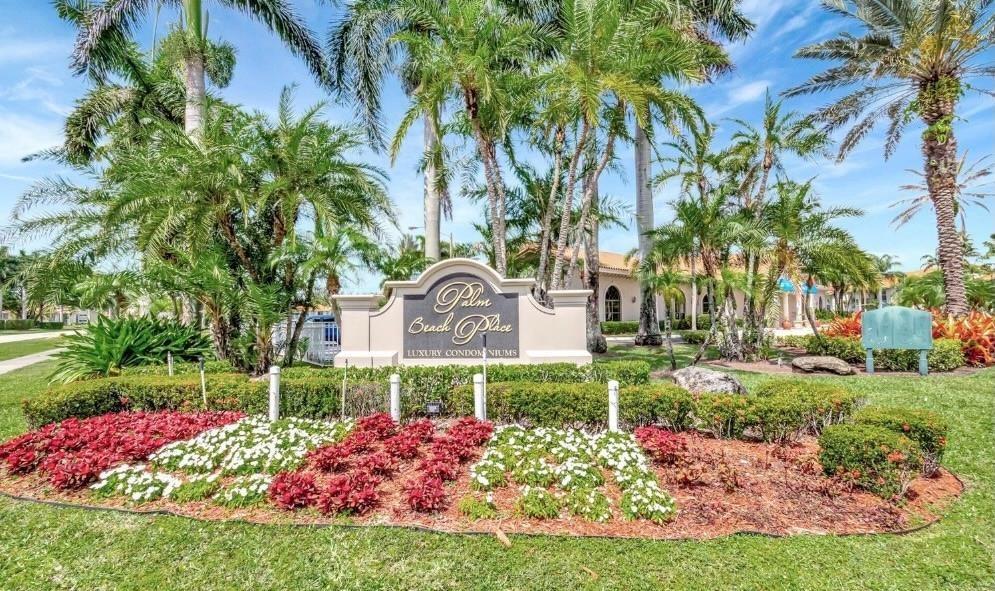 1520 Windorah Way, Unit E West Palm Beach, FL 33411 - Photo 6 of 12 a front view of a house with a yard and fountain