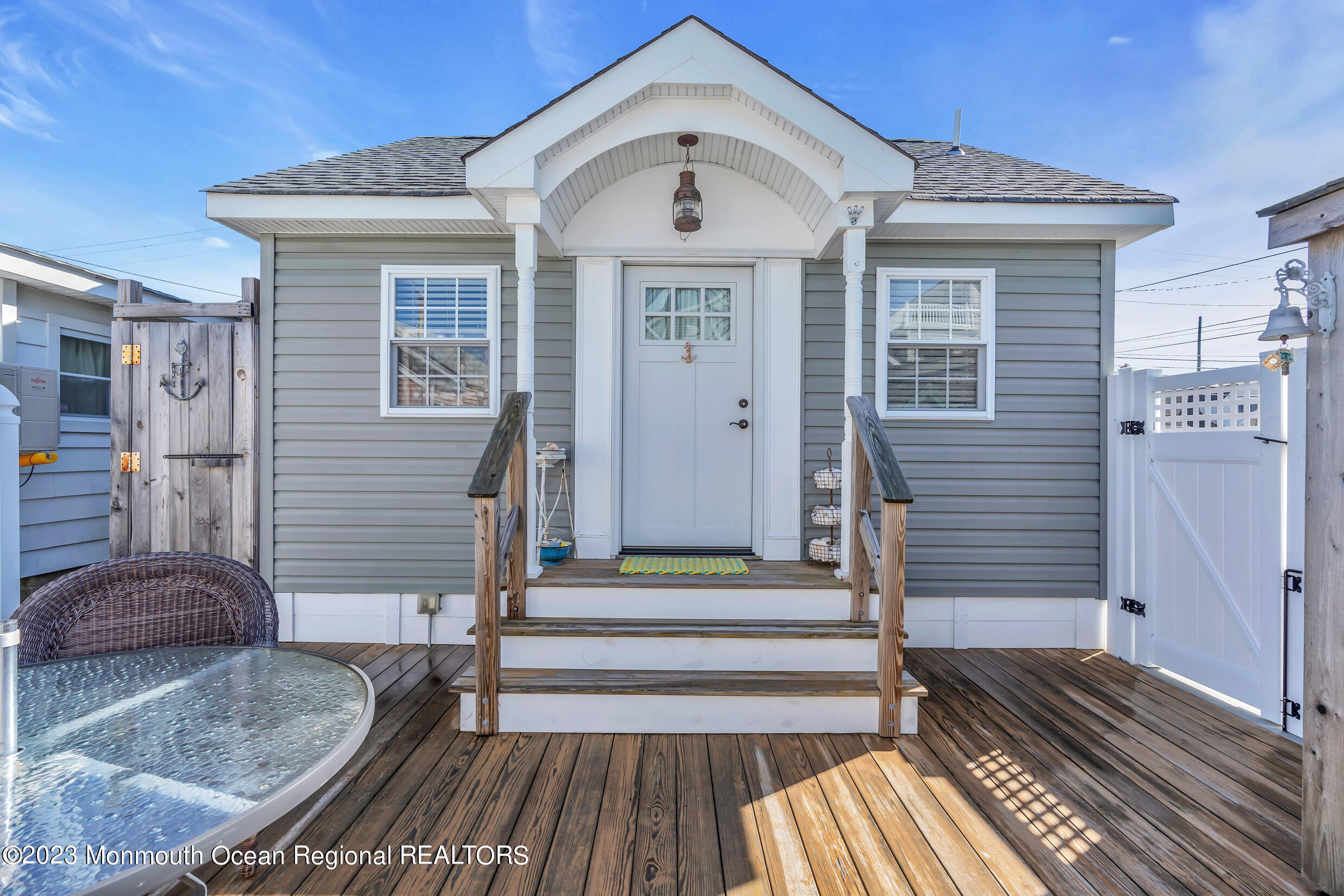 47 Shore Villa Road, Unit 114 South Seaside Park, NJ 08752 - Photo 1 of 1 a front view of a house with a door