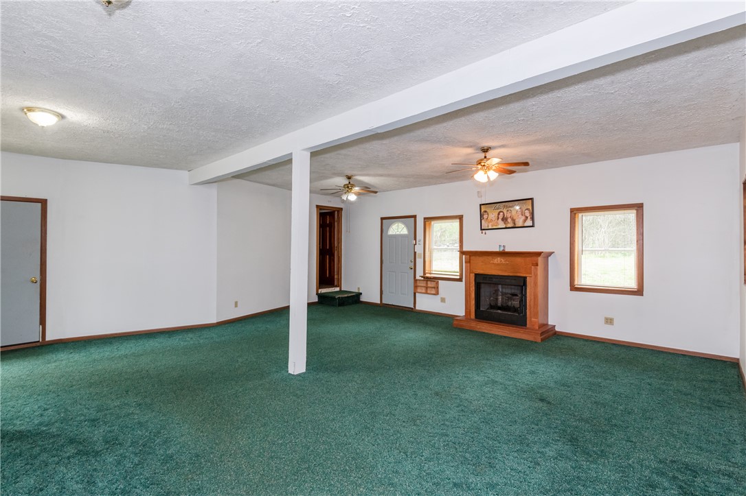 6750 Little Twin Road Germantown, OH 45327 - Photo 50 of 88 This expansive room offers comfortable carpeting, a warm fireplace, and generous natural light.