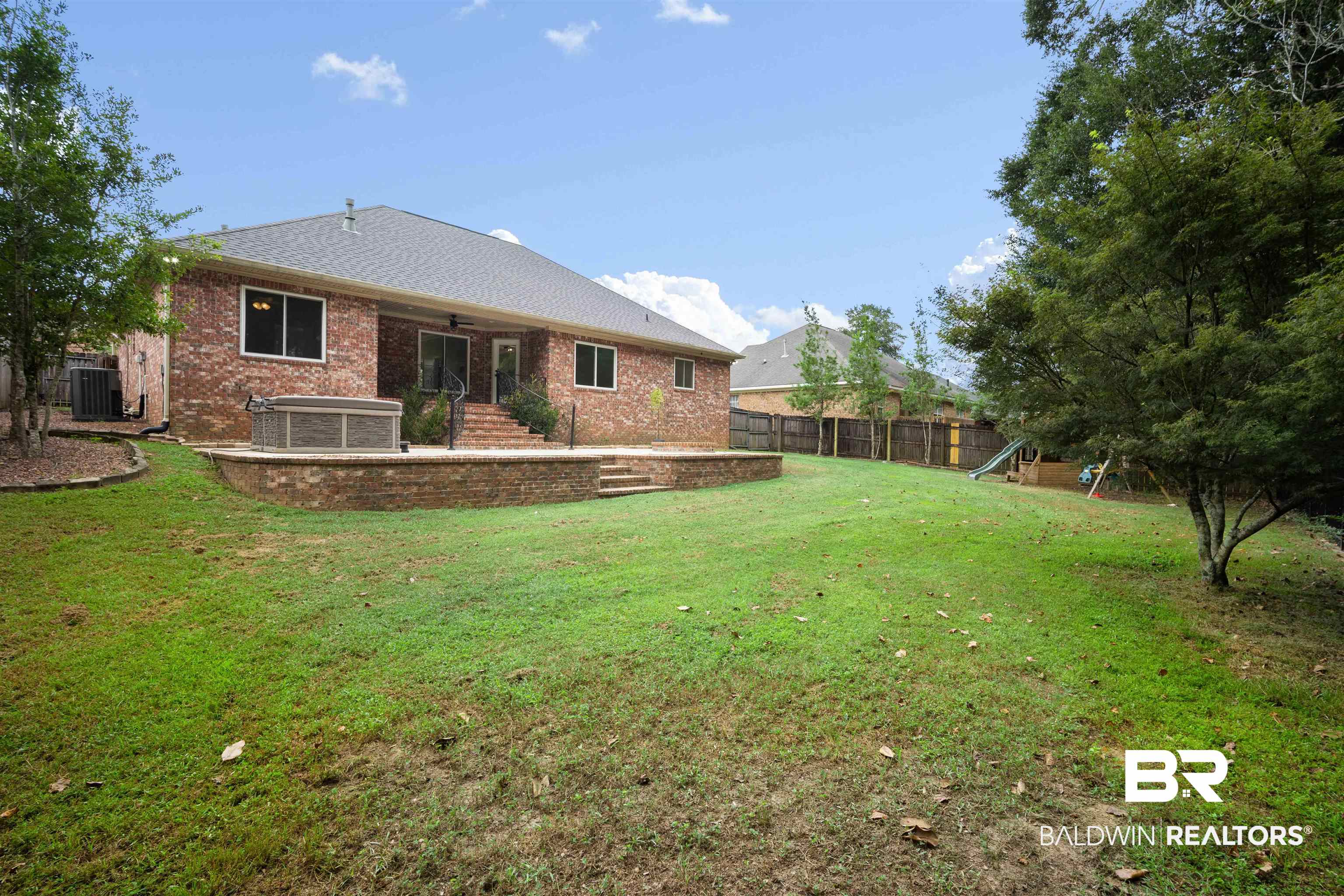 1685 Stonebridge Court Mobile, AL 36695 - Photo 29 of 29 Back of property with a patio, brick siding, ceiling fan, a fenced backyard, and a shingled roof