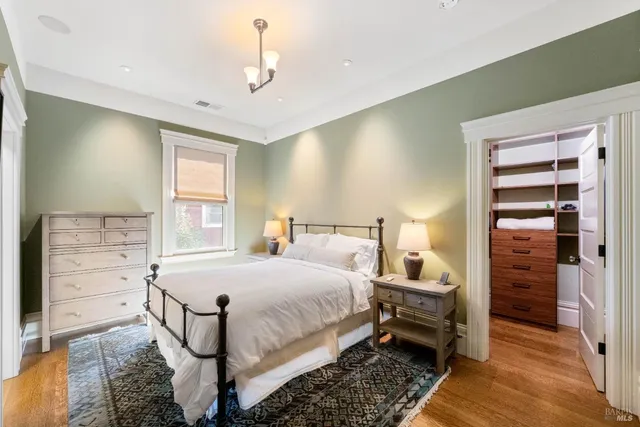 a bedroom with a bed and a cabinets