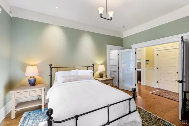 a bed room with a bed and a night stand