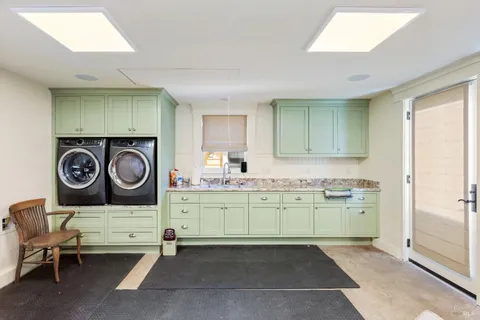 a view of a house with backyard sitting area and garden